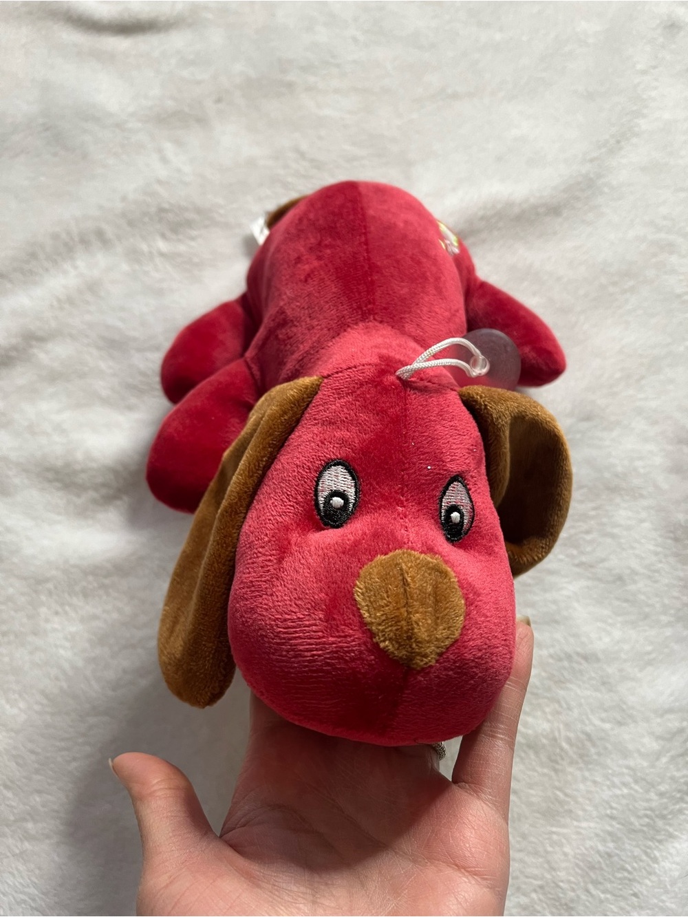 Red Plush Dog Toy with Brown Ears and Nose